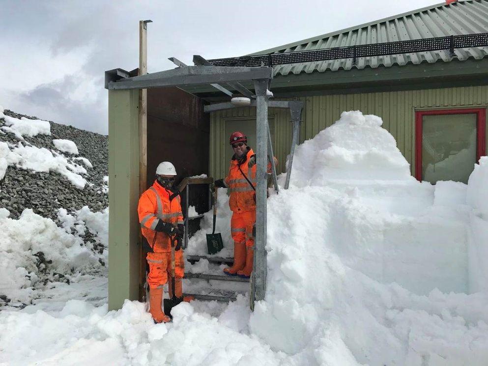 Construction team clearing snow to start work on building the new scientific support facility.