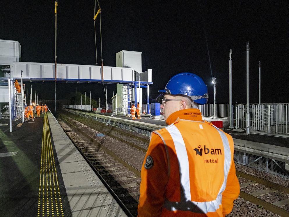 The installation of the footbridge at night