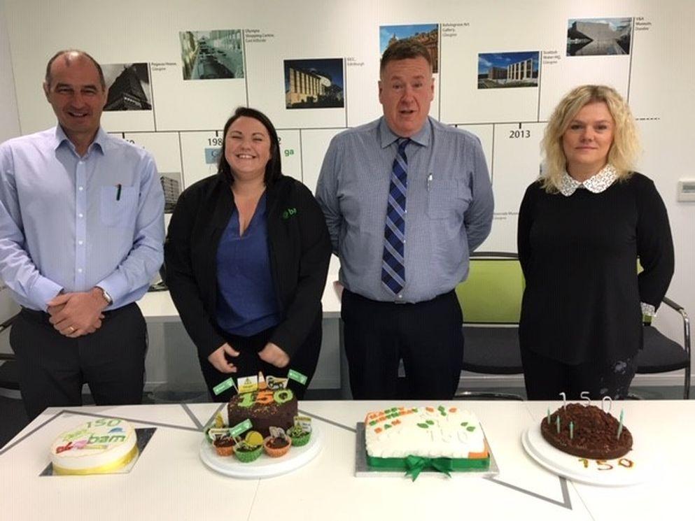 Bakers of the Edingburgh office with their cakes
