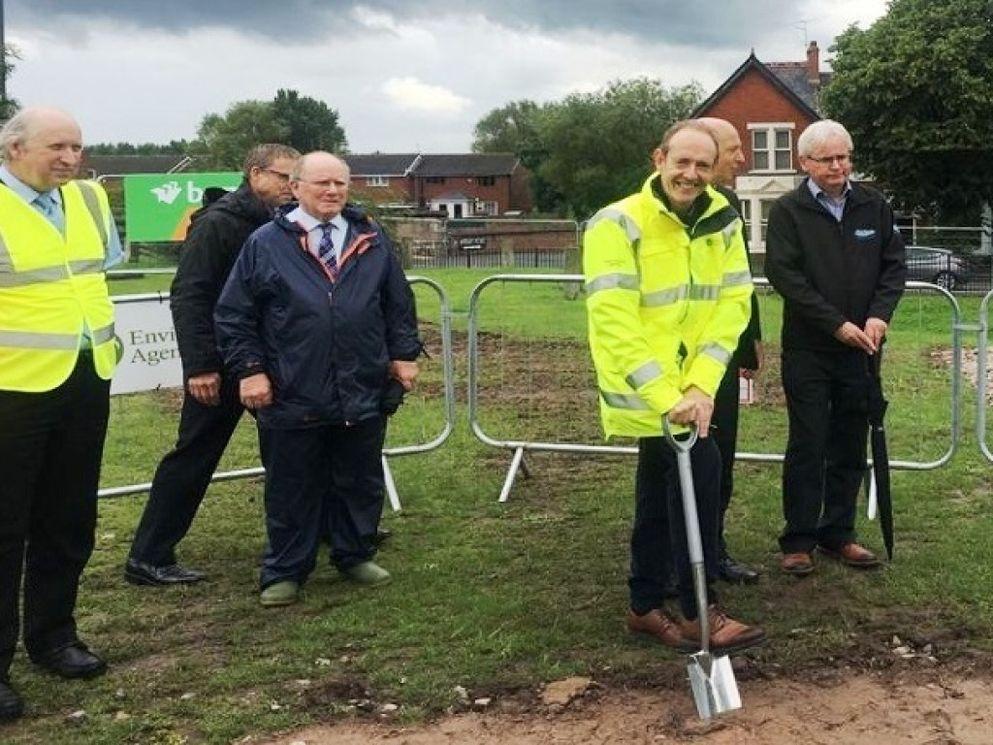 Sir James Bevan taking part in a sod turning event in the local community.